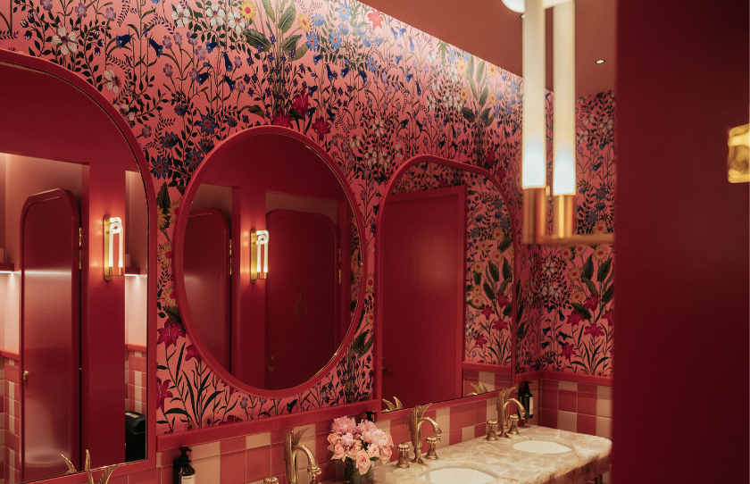 Luxurious bathroom in deep red and ruby shades at Humphrey's Hotel & Hatch Restaurant.