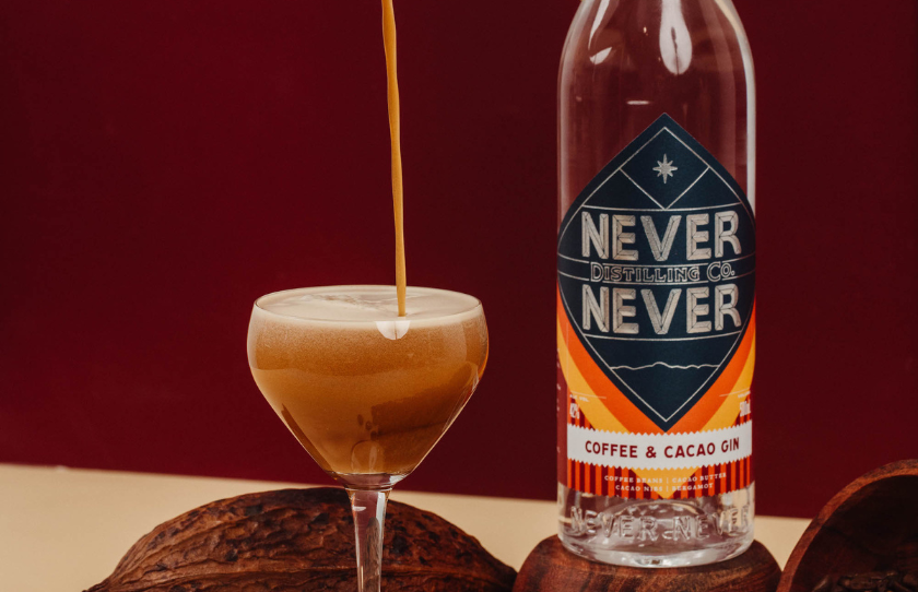 Never Never Distilling Co. Coffee & Cacao Gin espresso martini portrait pour coffee cacaco wood plinth.