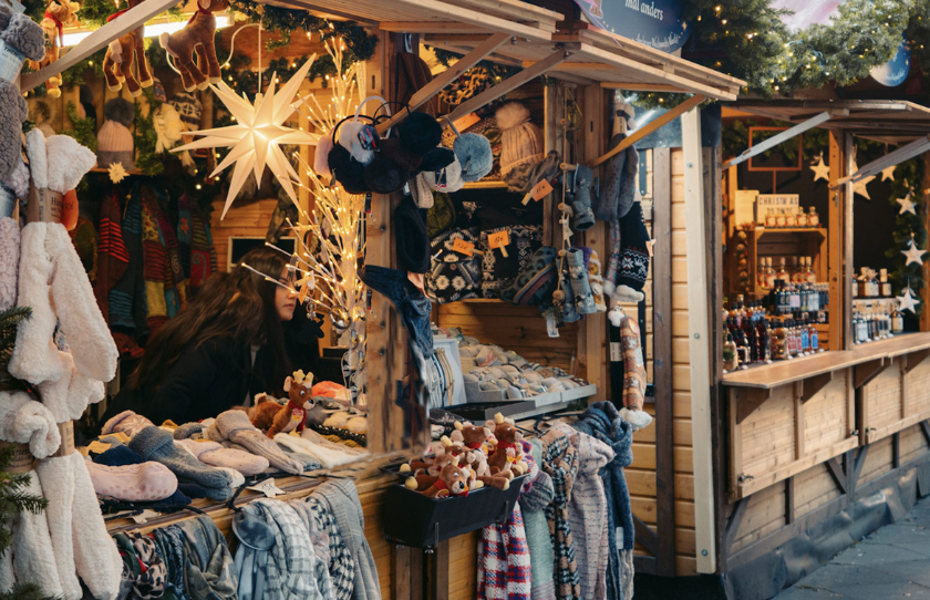 Traditional wooden huts with festive clothes at Le Jolly Christmas Market.