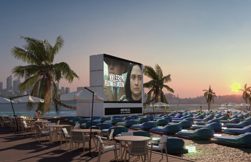 Render of queen beds set on top of sand across Sydney harbour for an outdoor bed movie night.
