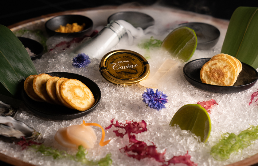 Caviar and blinis presented on bed of ice at Japanese restaurant Oribu.