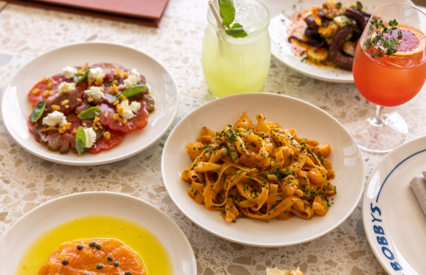 Selection of share plate menu items at Bobby's Cronulla including ox heart tomato and pasta.