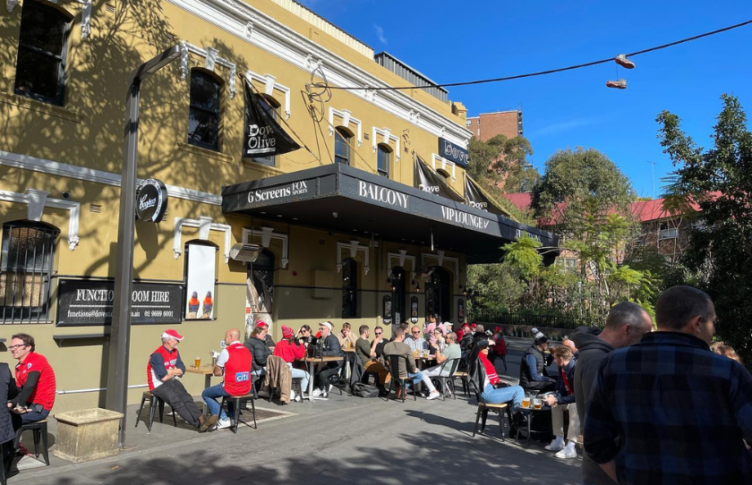 Outside area of Dove and Olive bar in Surry Hills. People sitting outside on a sunny day.