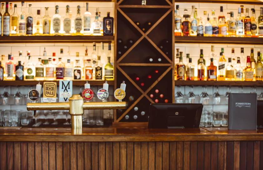 Forrester's Pub Bar showing till, beer taps and spirits 