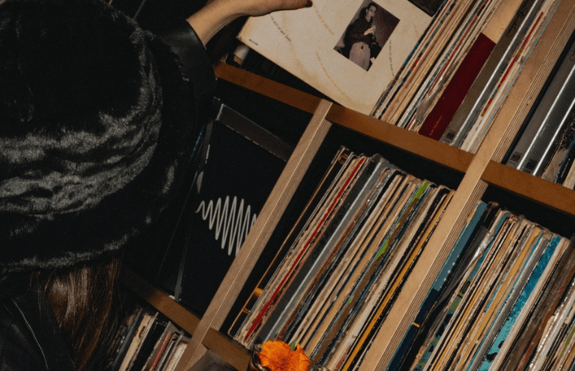 Sydney Best Vinyl Bars - Girl Grabbing record from shelf at Rekodo