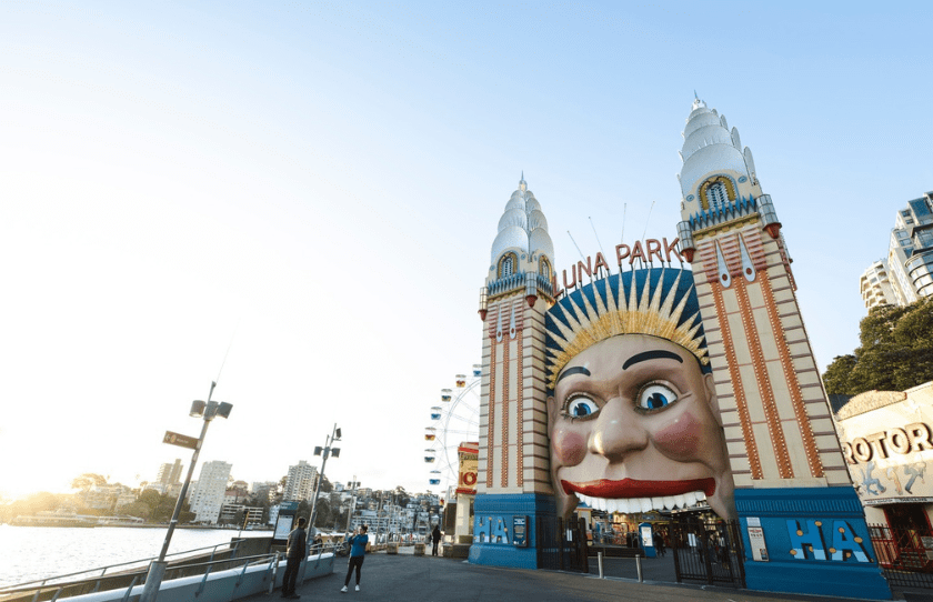 Outside Luna Park with Sign and harbour - for sale