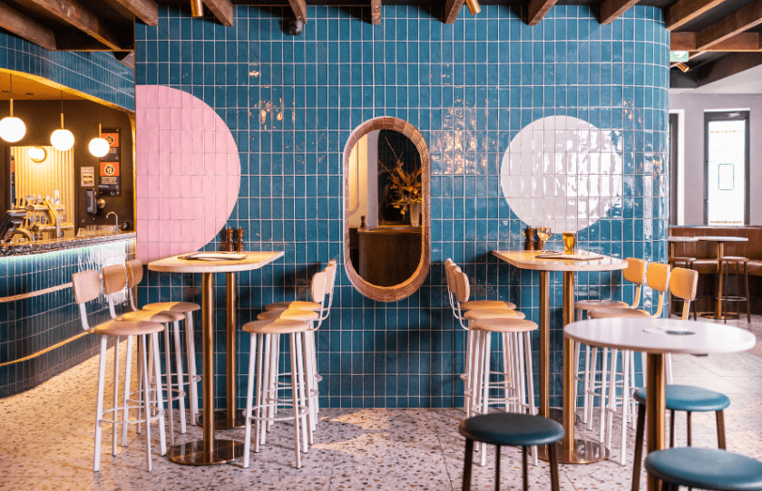 Potts Point Pennys Interior Pink and Blue Tiles and high stools with the bar in the background