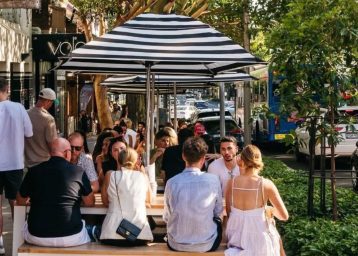 Sydney scraps no standing rules at bars, and they’re celebrating with cheap drinks